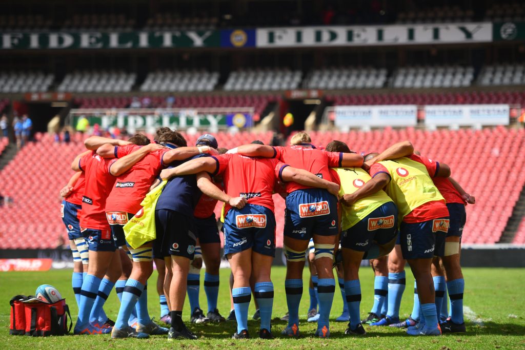 Vodacom Bulls team huddle up during a warm-up routine at the Emirates Airline Park (c) Vodacom Bulls/Johan Rynners