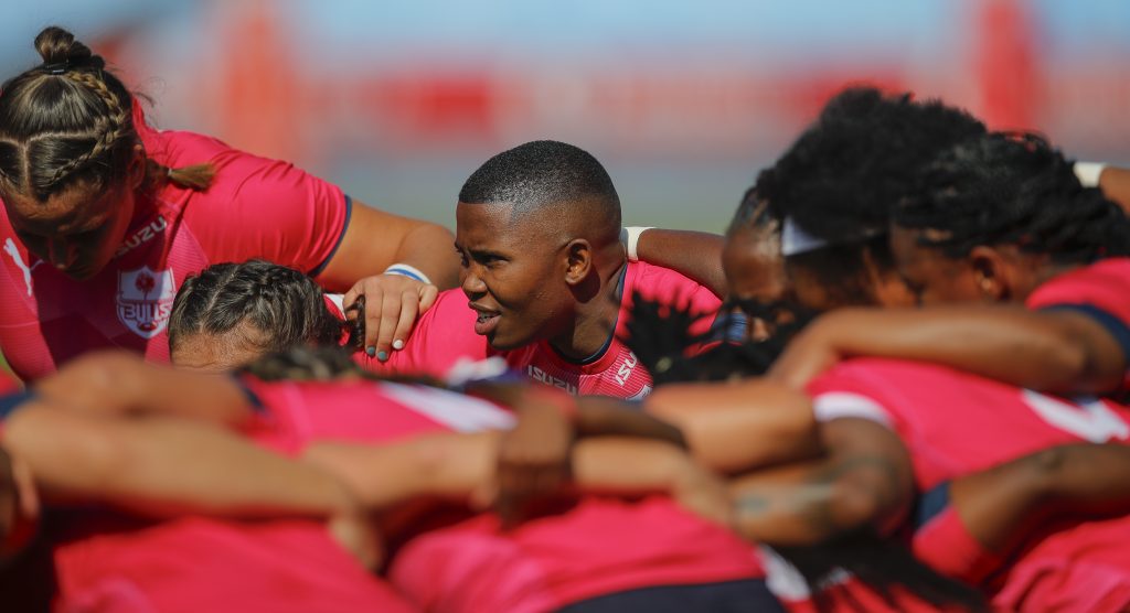 The Bulls Daisies come together in a huddle as they prepare to play against the Border Ladies at Loftus Versfeld Stadium (c) Vodacom Bulls/Johan Rynners