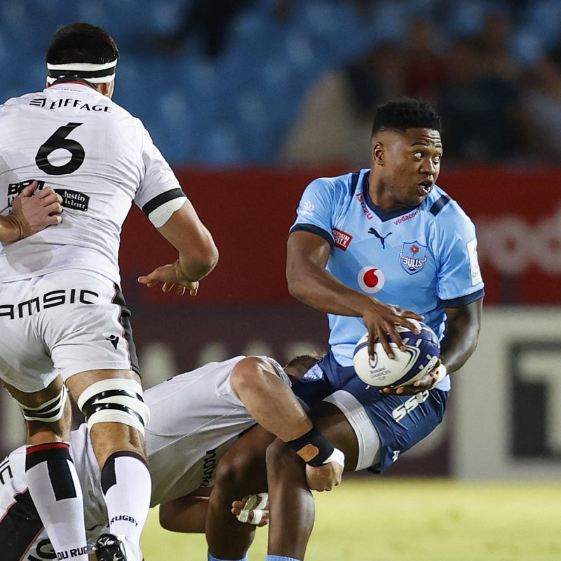Bulls Wandisile Simelane (R) is tackled by Lyons Arno Botha (2nd R) during the European Champions Cup pool A rugby union match between Bulls and Lyon at Loftus Versfeld Stadium in Pretoria on December 10, 2022 (c) EPCR/AFP/GETTY