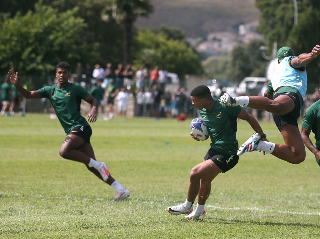 South Africa's wing Kurt-Lee Arendse (2-L) runs with the ball during the team's training session in Biguglia ahead of the 2023 Rugby World Cup in France (c) EPCR via Getty Images