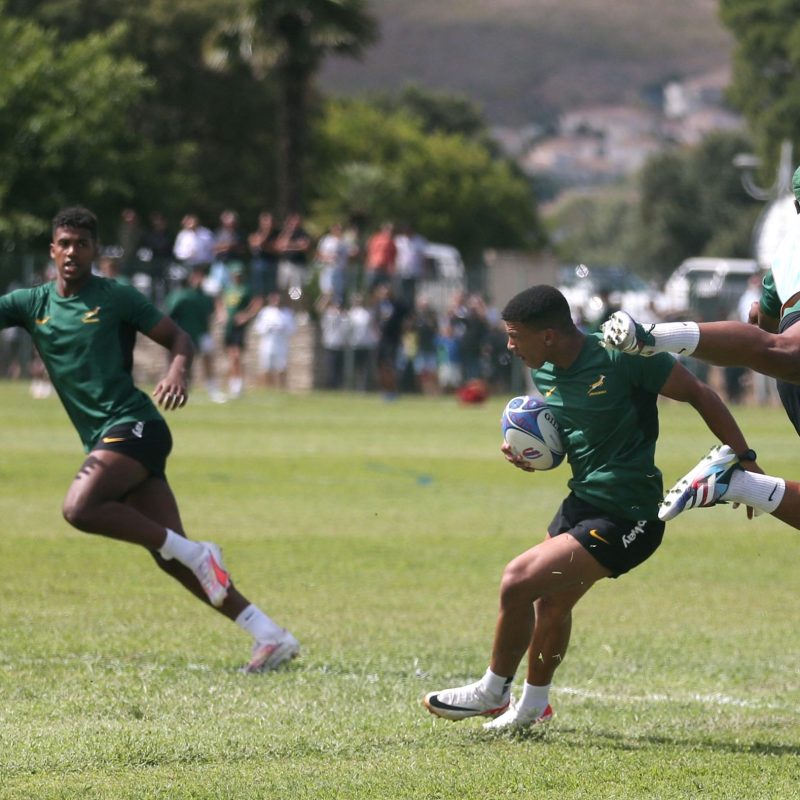 South Africa's wing Kurt-Lee Arendse (2-L) runs with the ball during the team's training session in Biguglia ahead of the 2023 Rugby World Cup in France (c) EPCR via Getty Images